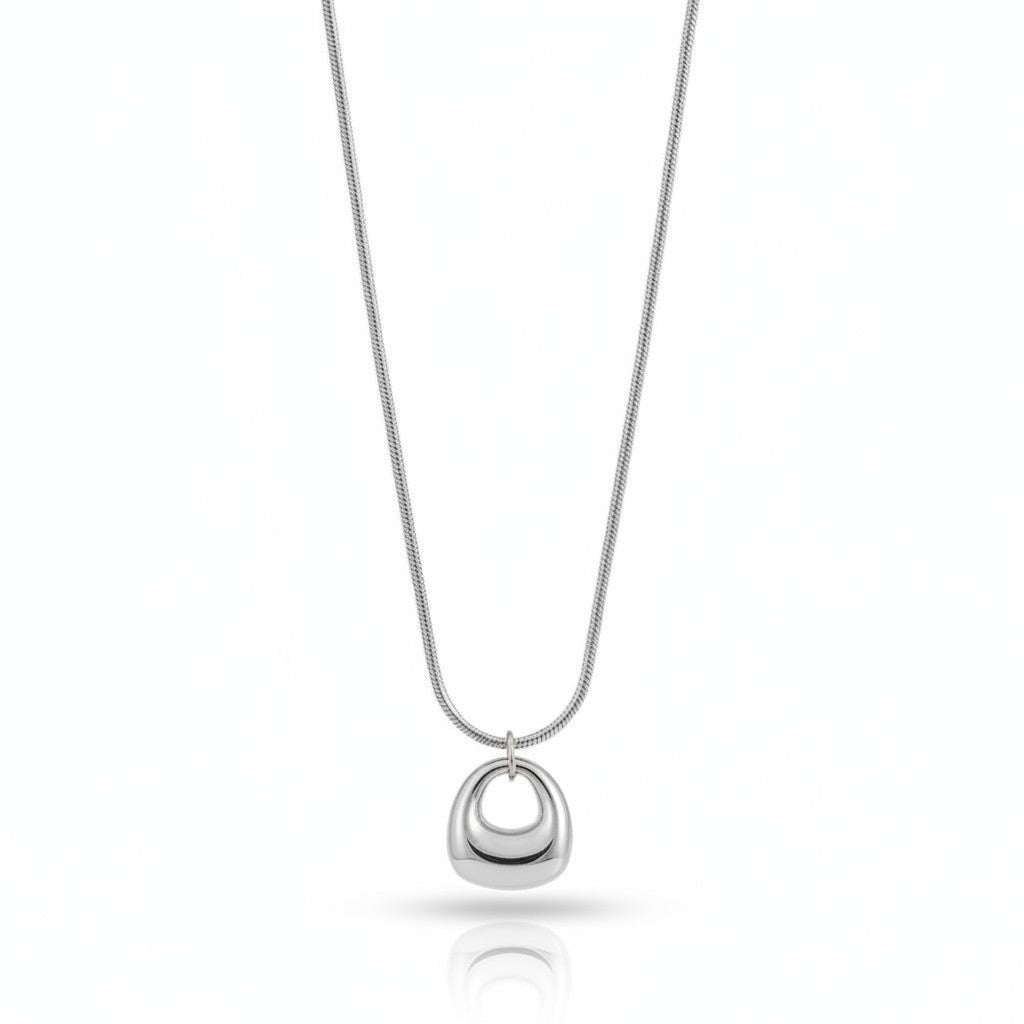 PRO RAY KAREYA gold geometric pendant necklace with smooth sculptural curves on a snake chain.