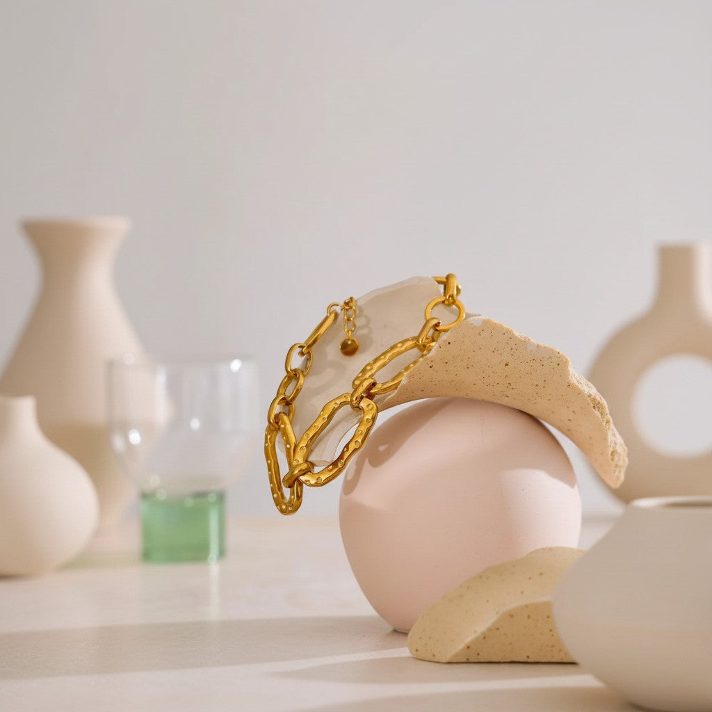 PRO RAY AUREVA gold chain bracelet with textured sculptural links, 19cm + 4cm adjustable length.