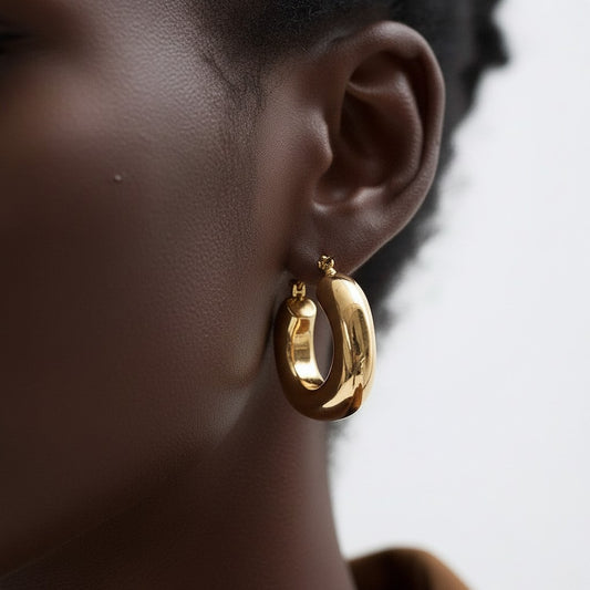 PRO RAY SOREYA sculptural gold-tone hoops with a smooth curved form, 30mm diameter.