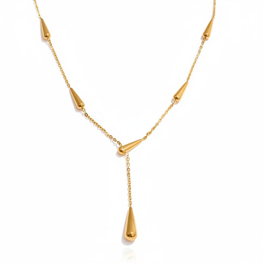 PRO RAY AIRA gold-tone necklace with drop-shaped accents on a delicate chain. Modern elegance.