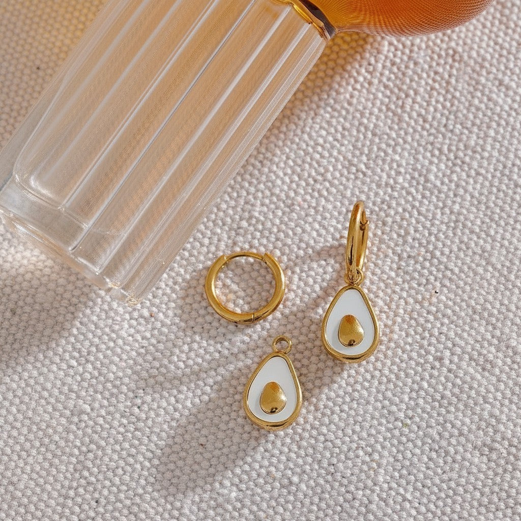 PRO RAY gold drop earrings with white shell and gold avocado detail. Delicate statement piece.