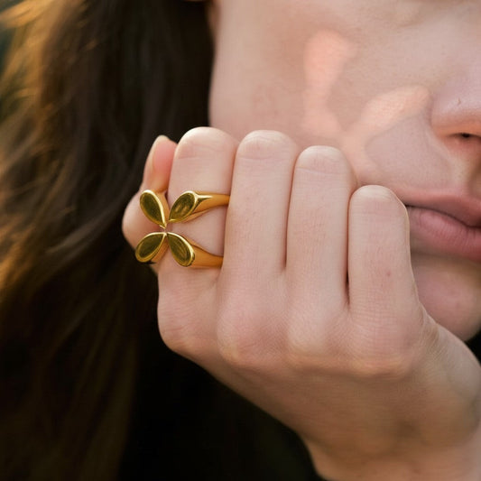 PRO RAY gold open ring with petal-inspired shapes and sculptural silhouette, polished finish.