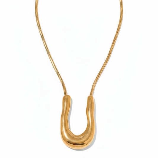 PRO RAY ELORA gold sculptural pendant necklace with fluid organic curves and snake chain.
