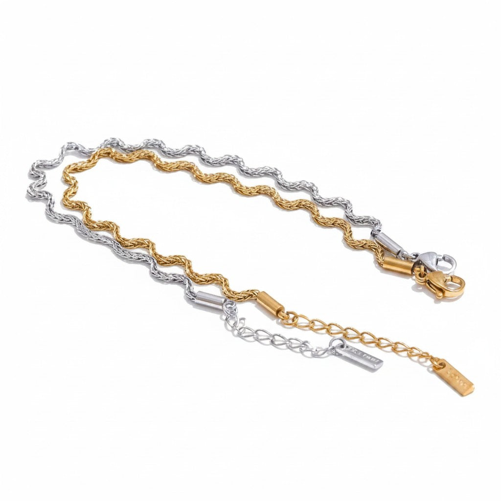 PRO RAY ELVARA bracelet with a gold and silver wave chain, minimalist design, textured detailing, and adjustable clasp.