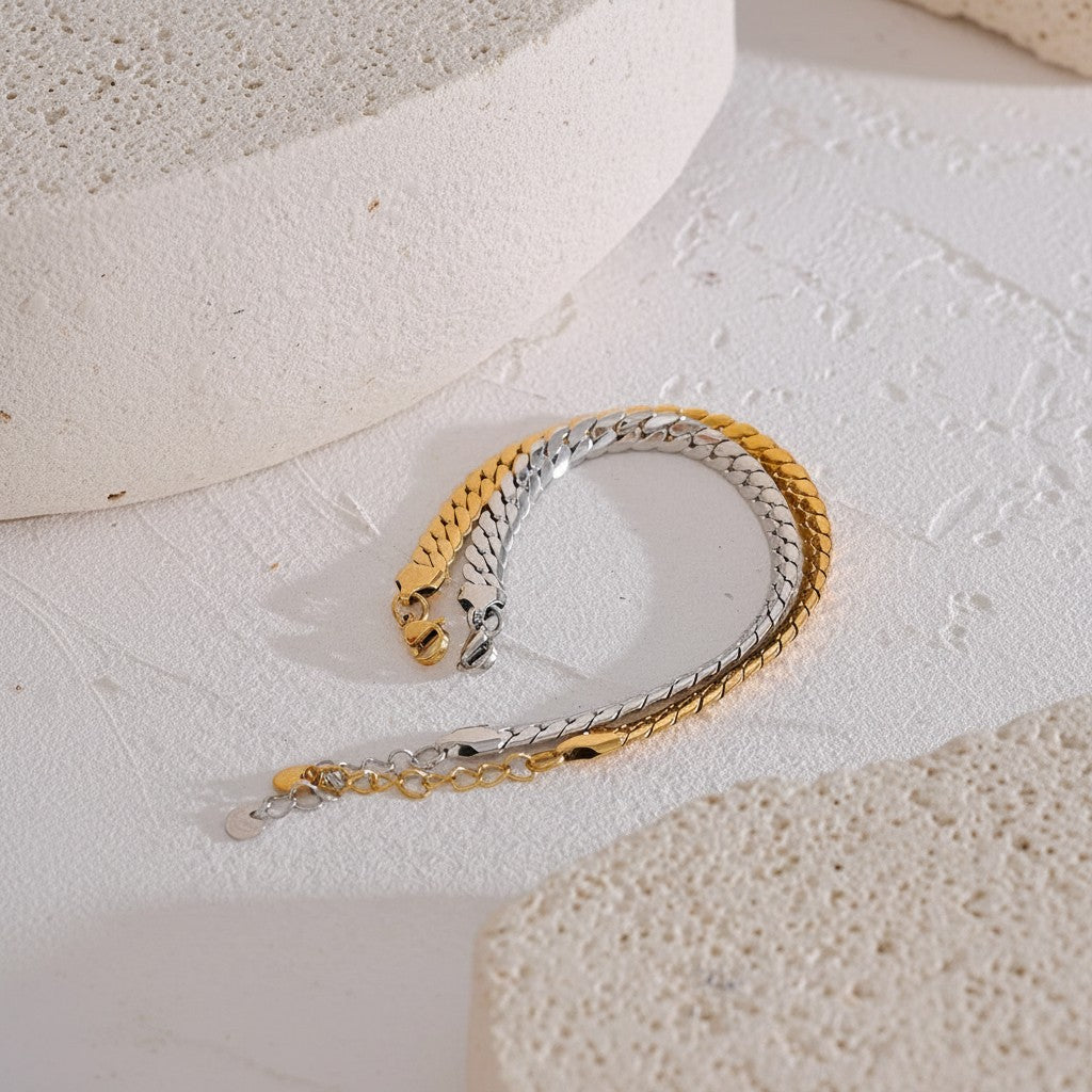 PRO RAY KAEVRA bracelet with polished gold and silver curb chain links, 7mm wide, adjustable length.