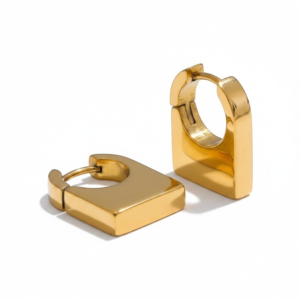 PRO RAY KAIA sculptural rectangular gold hoop earrings with polished finish and architectural silhouette.