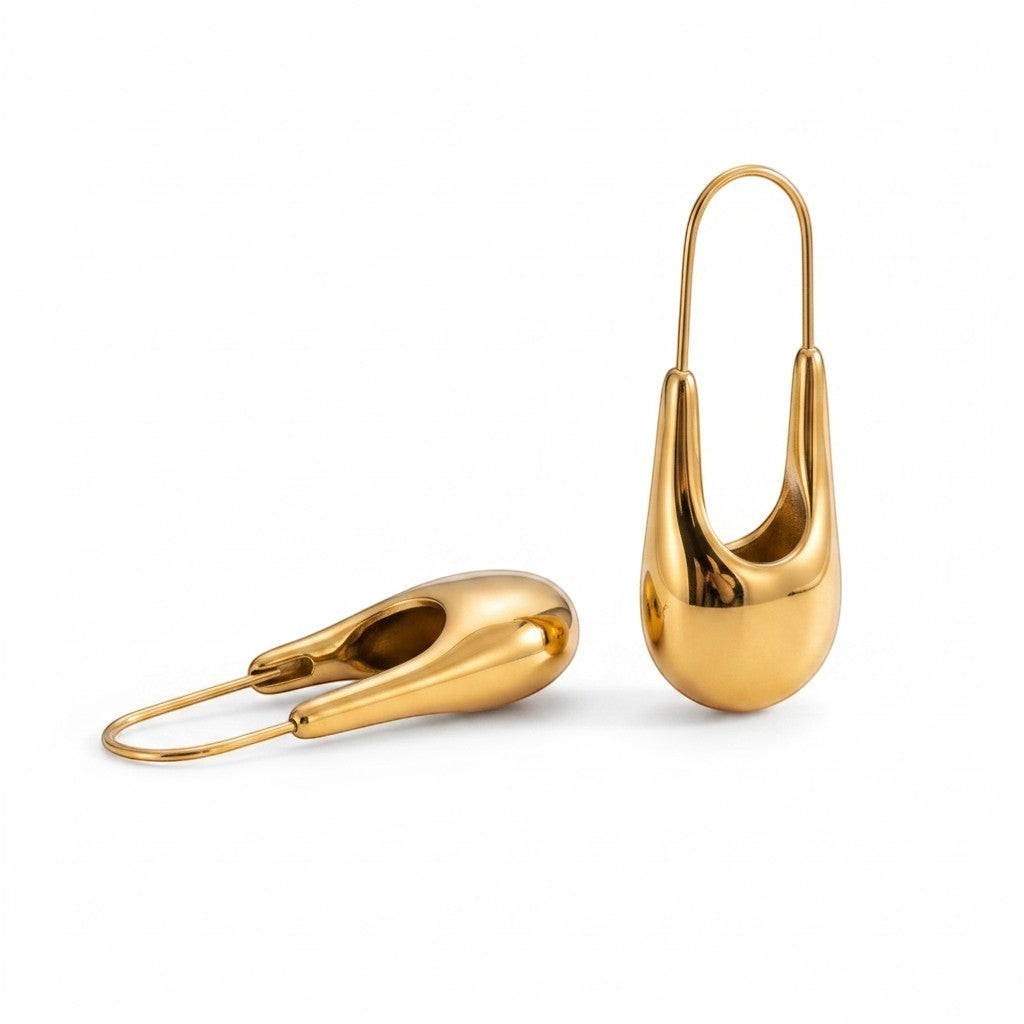 PRO RAY NYRA Hoops sculptural drop earrings in polished gold finish with elongated silhouette.