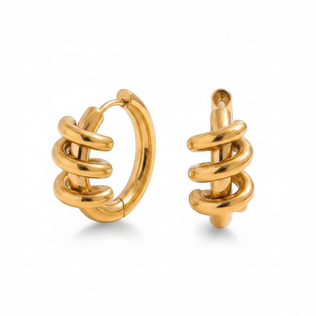 PRO RAY gold sculptural spiral hoop earrings with a polished finish and fluid silhouette.