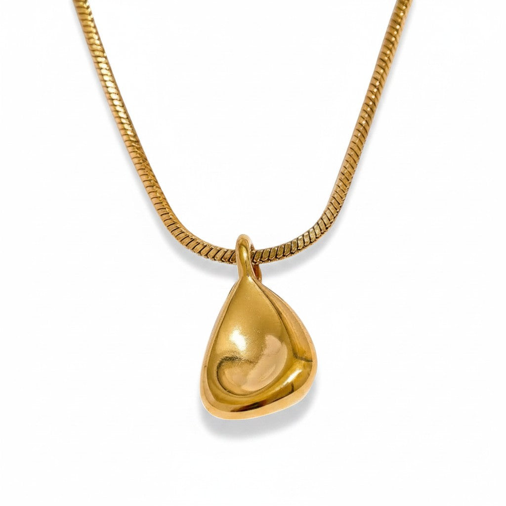 PRO RAY TELYA sculptural gold pendant necklace with soft flowing curves on a snake chain.